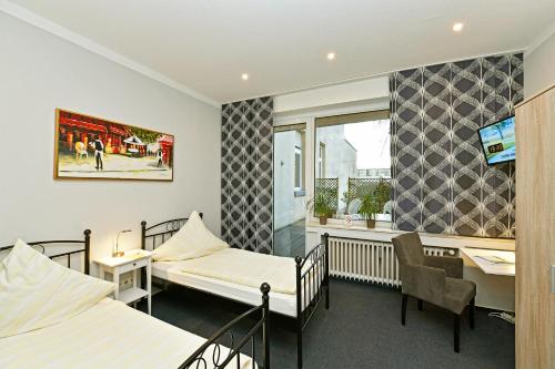 Postel nebo postele na pokoji v ubytování Hotel Haus Kleimann-Reuer