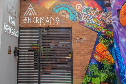 an entrance to a keramax studio with a door at Che Hermano Suítes in Foz do Iguaçu