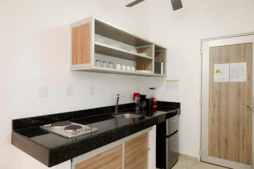 a kitchen with a sink and a counter top at Hotel Villa Varadero in Nuevo Vallarta 