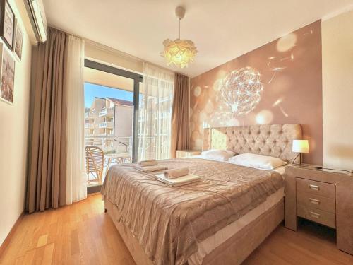a bedroom with a large bed and a large window at Sunset Poolside Retreat BlueH in Budva
