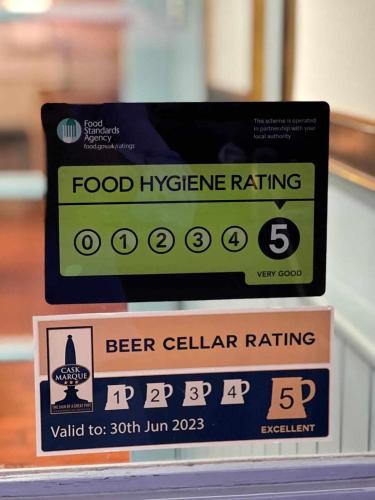 a food hygiene rating sign on top of a box of beer cellulararing at The Shoulder at Hardstoft in Hardstoft