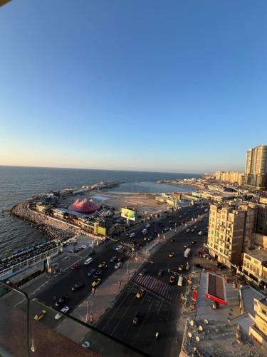 an aerial view of a city with the ocean at Nubian Village by the Sea in Alexandria
