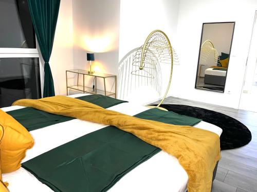 a bedroom with a bed with a blanket on it at Weißes Haus in Gerasdorf bei Wien