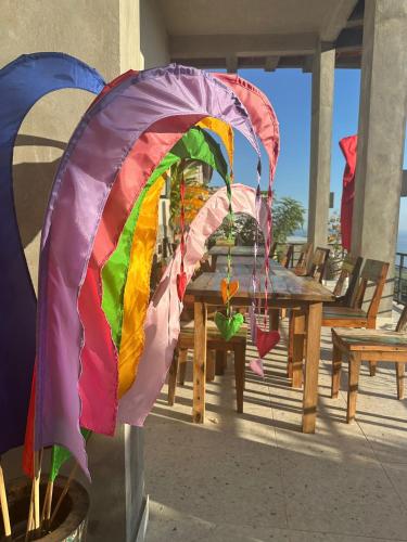 a colorful kite is attached to a table at Liri Villa - 4 BRs - Ocean, Valley view in Temukus