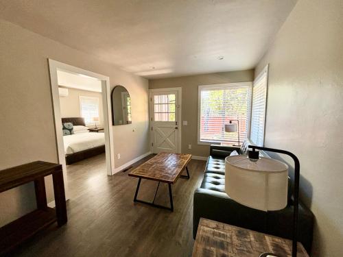 a living room with a couch and a table at Hidden Valley Inn in Carmel Valley
