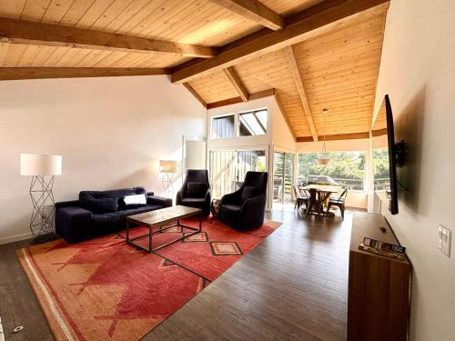 a living room with a couch and chairs and a table at Hidden Valley Inn in Carmel Valley