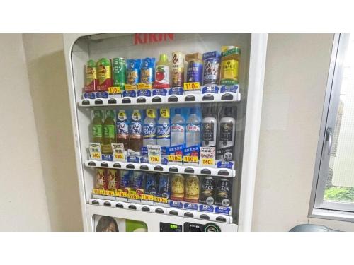 a refrigerator filled with lots of soda and sodas at Takatsuki W&M Hotel - Vacation STAY 02642v in Takatuki