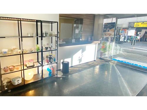 a store front with a display case in a store at Takatsuki W&M Hotel - Vacation STAY 02645v in Takatuki