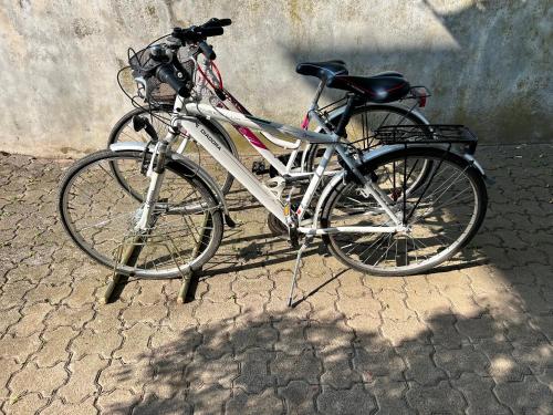 a bicycle is parked next to a wall at Guest House Italo & Anna in Pasian di Prato