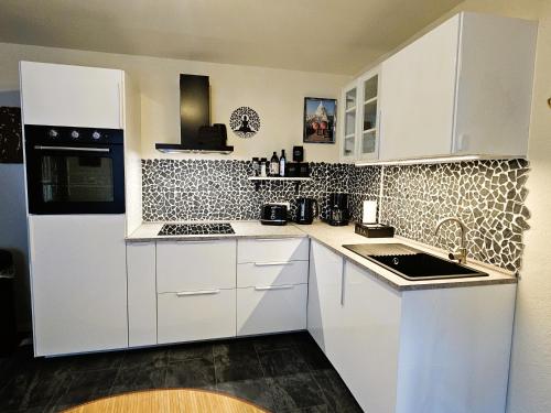 Η κουζίνα ή μικρή κουζίνα στο Asiatisches Apartment