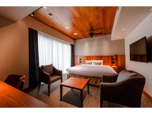 Giường trong phòng chung tại PROSTYLE TERRACE NAHA - Vacation STAY 53651v