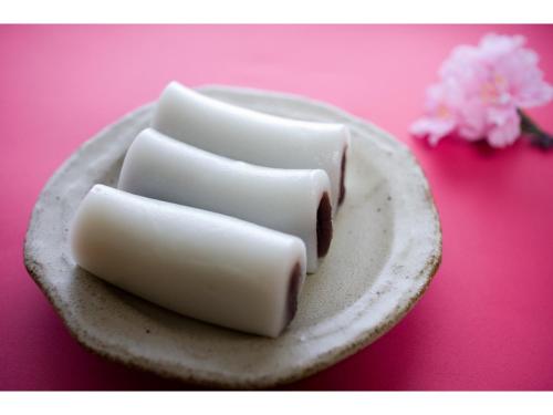 two white marshmallows sitting on a plate on a table at Asuka Hotel - Vacation STAY 59965v in Karatsu