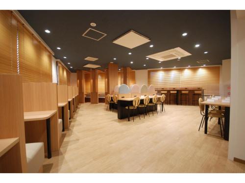 a conference room with tables and chairs in it at Sun Hotel Kokubu - Vacation STAY 62468v in Kirishima