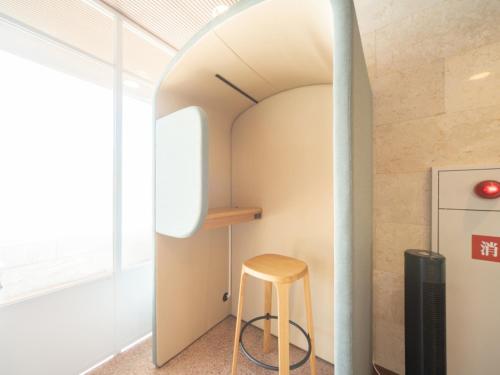 a stool in a kitchen with an archway at Sun Hotel Kokubu - Vacation STAY 62468v in Kirishima