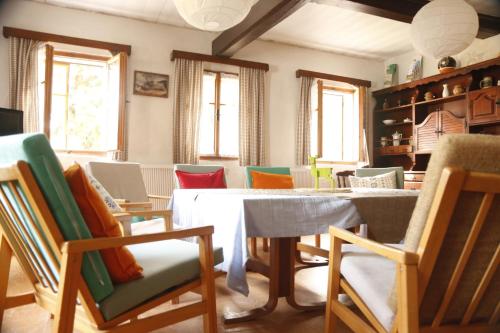 a dining room with a table and chairs at Chalupa Bílá Desná in Jablonec nad Nisou