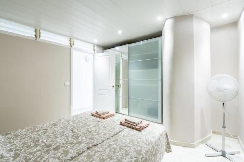 Ένα ή περισσότερα κρεβάτια σε δωμάτιο στο Apartment by the sea in Los Cristianos