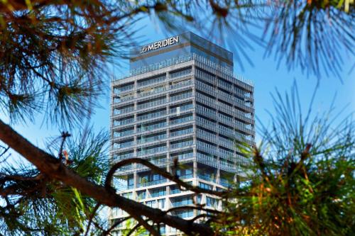 a building with a amazon sign on top of it at Le Meridien Istanbul Etiler in Istanbul