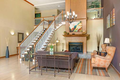 a living room with a couch and a fireplace at Best Western Plus Waco North in Waco
