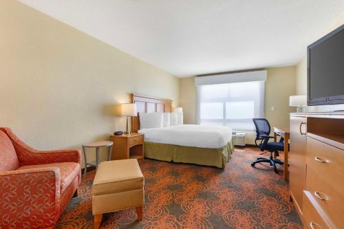 a hotel room with a bed and a tv at Best Western Plus Waco North in Waco