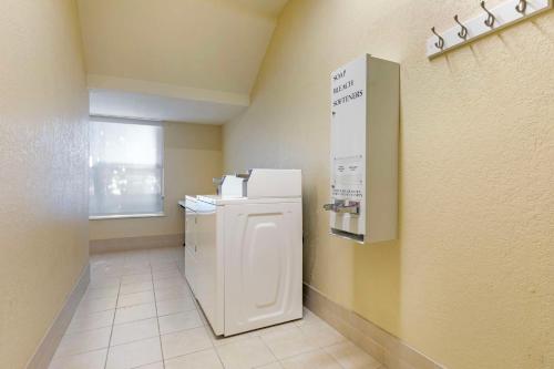 a kitchen with a white refrigerator in a room at Best Western Plus Waco North in Waco