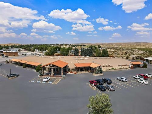 an aerial view of a building with cars parked in a parking lot at Best Western Outlaw Inn in Rock Springs