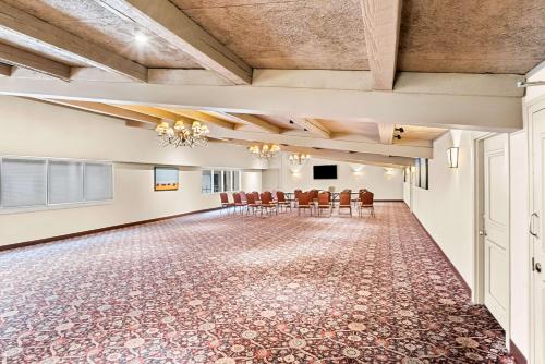 a large room with chairs and a table in it at Best Western Outlaw Inn in Rock Springs