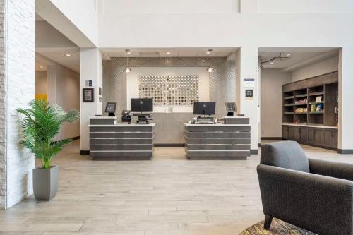 an office with two reception desks and two chairs at Best Western Plus Cranberry-Pittsburgh North in Cranberry Township