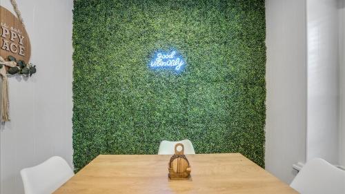 a shoe sitting on a table in front of a green wall at Holiday 4BR 2BA Home with Pool, Hot Tub, Fire Pit in Irving