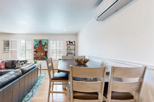 a kitchen and dining room with a table and chairs at Bird Street Breeze in Oak Bluffs