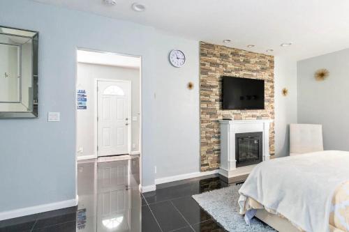 a bedroom with a bed and a fireplace at Chic Victorian Oasis - Oakland Heart in Oakland