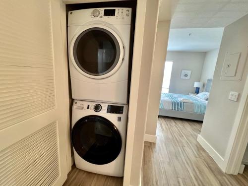 a washer and dryer in a hallway of a house at Spacious 2 Bedroom 2 Bathroom In Gated Community in Los Angeles