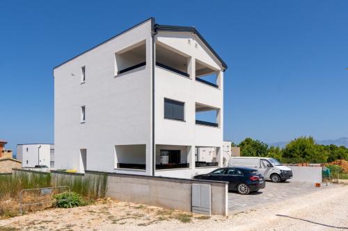 Apartments with a parking space Vir - Lozice, Vir - 23514