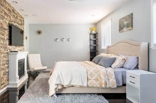a bedroom with a bed and a fireplace at Chic Victorian Oasis - Oakland Heart in Oakland