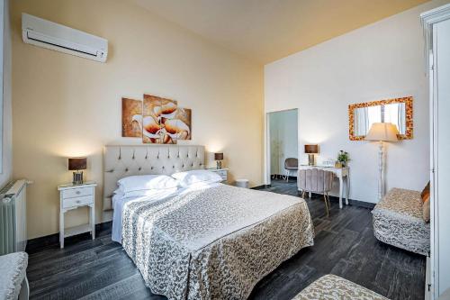 a hotel room with a bed and a table at Il Viaggiator Leggero in Florence