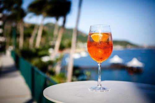 a glass of wine sitting on top of a table at Camino Real Acapulco Diamante in Acapulco