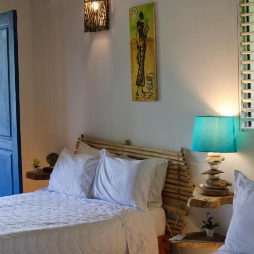 Katil atau katil-katil dalam bilik di VillasMana PlayaBonita LasTerrenas NearBeach