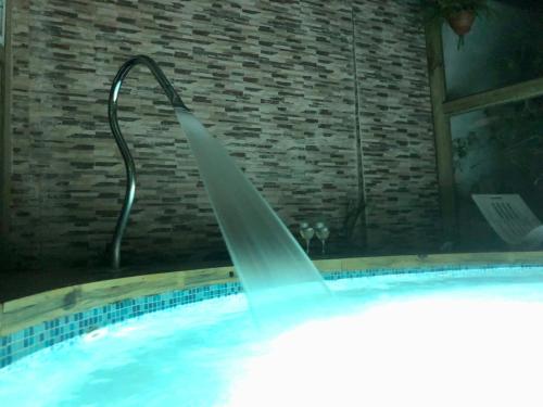 a water fountain in a swimming pool at Posada Agua Marina in La Paloma
