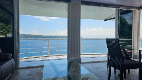 a living room with a view of the water at Lydia's House in Kaputian