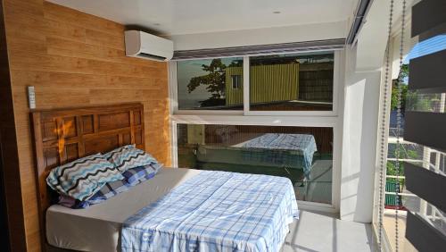 a bedroom with a bed and a window at Lydia's House in Kaputian