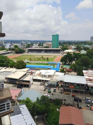 an aerial view of a city with a building at Avida Tower 1 in Cagayan de Oro