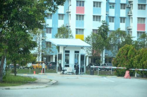 a building with a parking lot in front of it at Modern 4BR Double Storey @ Setia Alam in Shah Alam