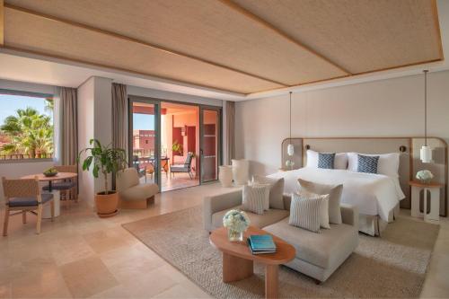 a bedroom with a bed and a living room at The Ritz-Carlton Tenerife, Abama in Guía de Isora