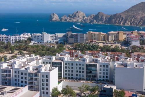 an aerial view of a city with buildings and the ocean at New 3BR in the Heart of San Lucas in Cabo San Lucas