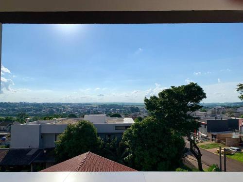 a view of a city with mountains in the background at The View 203 - aconchegante com vista para Cascavel - 2 quartos ar condicionado in Cascavel
