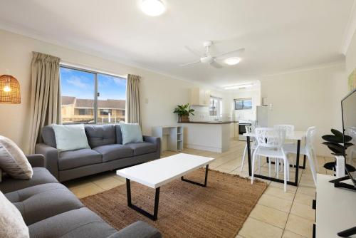 a living room with a couch and a table at Apartment 7T in Lennox Head