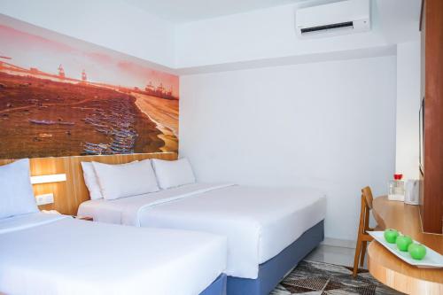 Ένα ή περισσότερα κρεβάτια σε δωμάτιο στο favehotel Cilacap