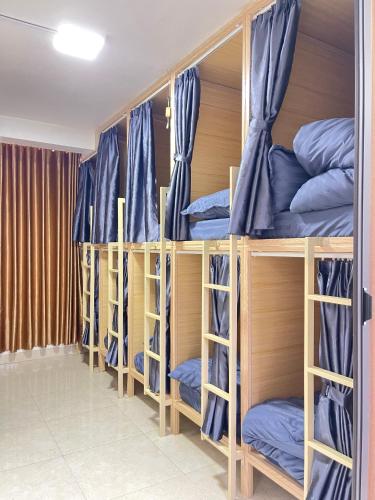 a group of bunk beds in a room at Nhat Sapa Hostel in Sapa
