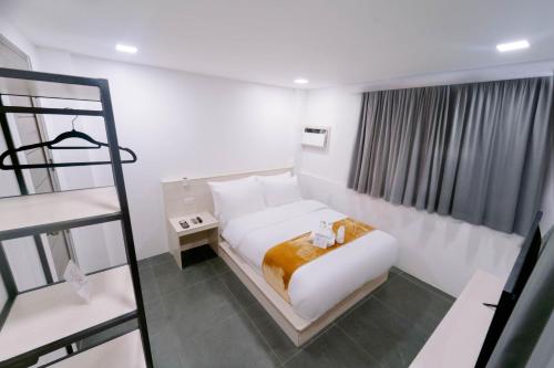 Postel nebo postele na pokoji v ubytování A Traveller's Inn