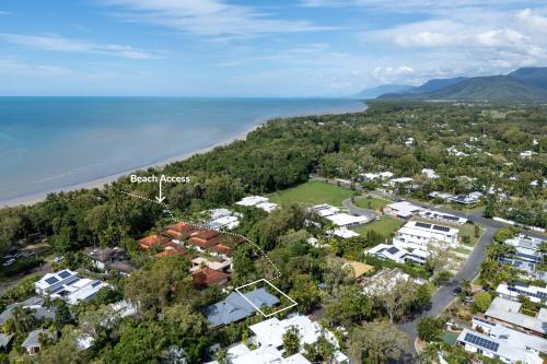 an aerial view of the beach and houses at The Savannah Villa in Port Douglas