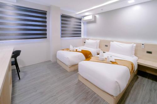 Postel nebo postele na pokoji v ubytování A Traveller's Inn